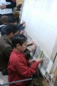 Young kids carpet weavinng